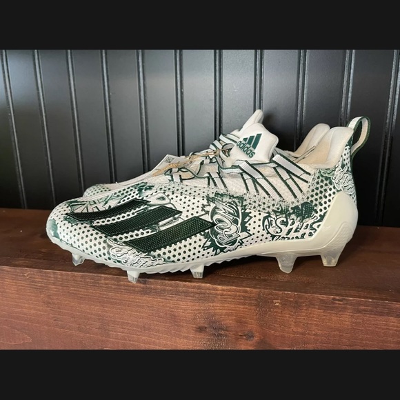 white and green adidas football cleats